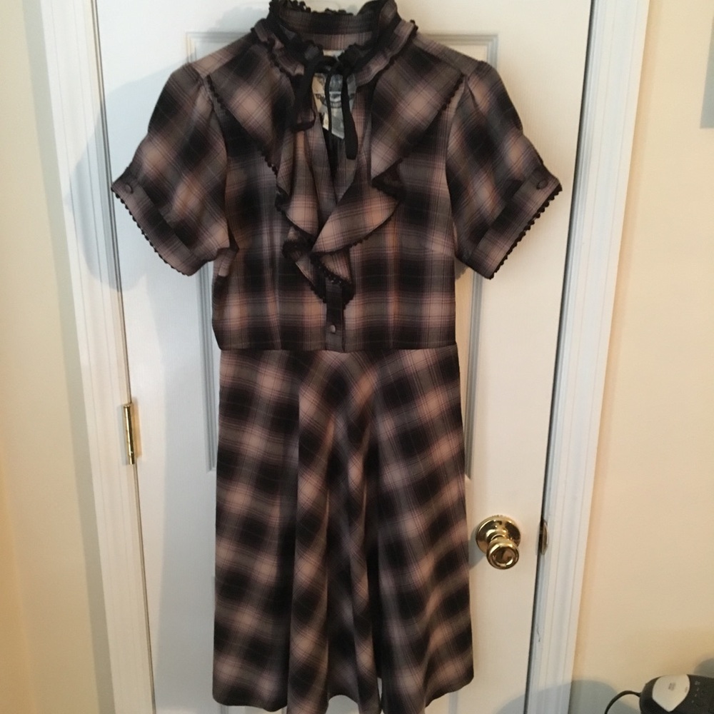 Plaid dress with ruffled neckline
